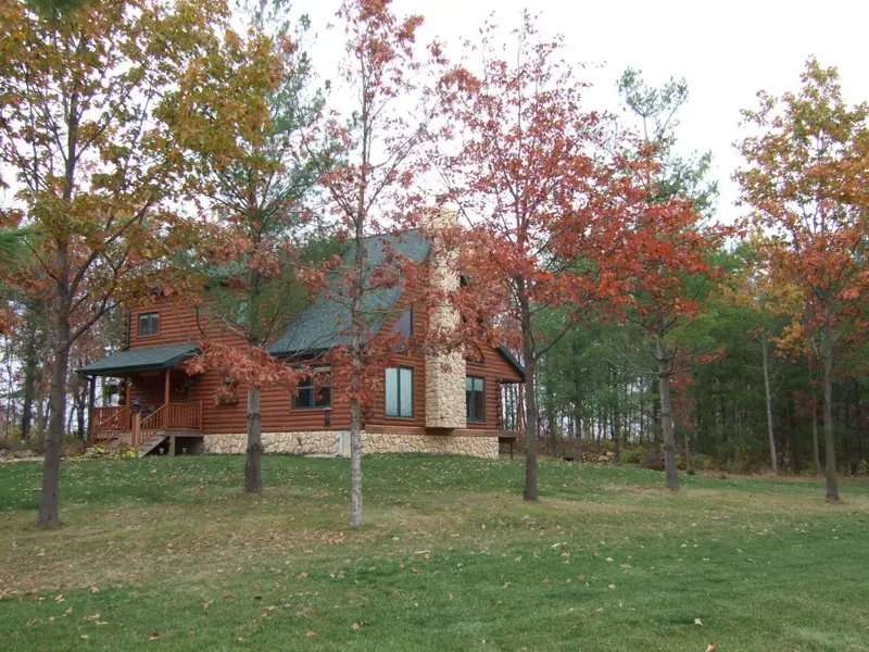 Finished home among fall trees