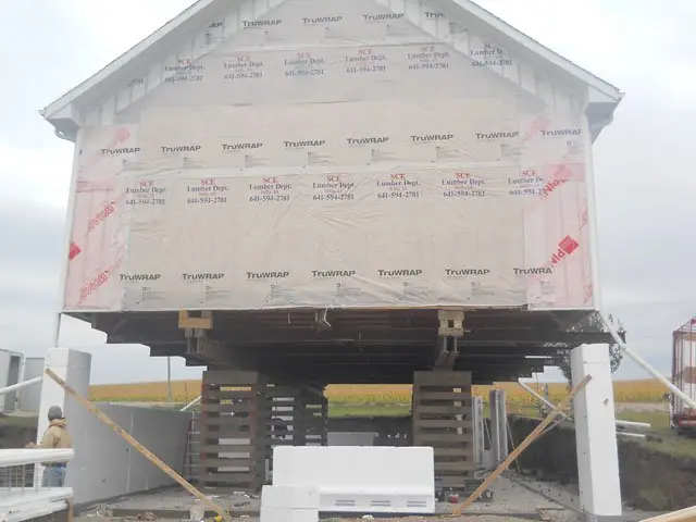 House raised on cribbing during a full foundation replacement