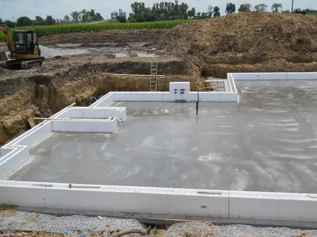Finished ICF basement walls and poured floor slab ready for framing