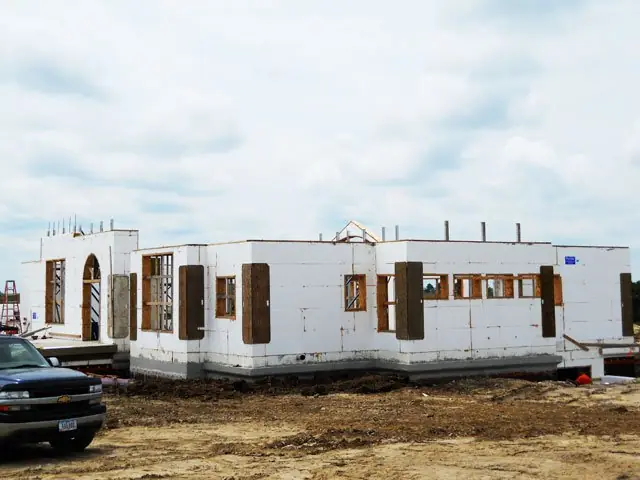 Completed ICF walls of a single-story home with window openings