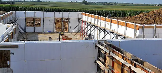 ICF basement walls going up beside an Iowa cornfield